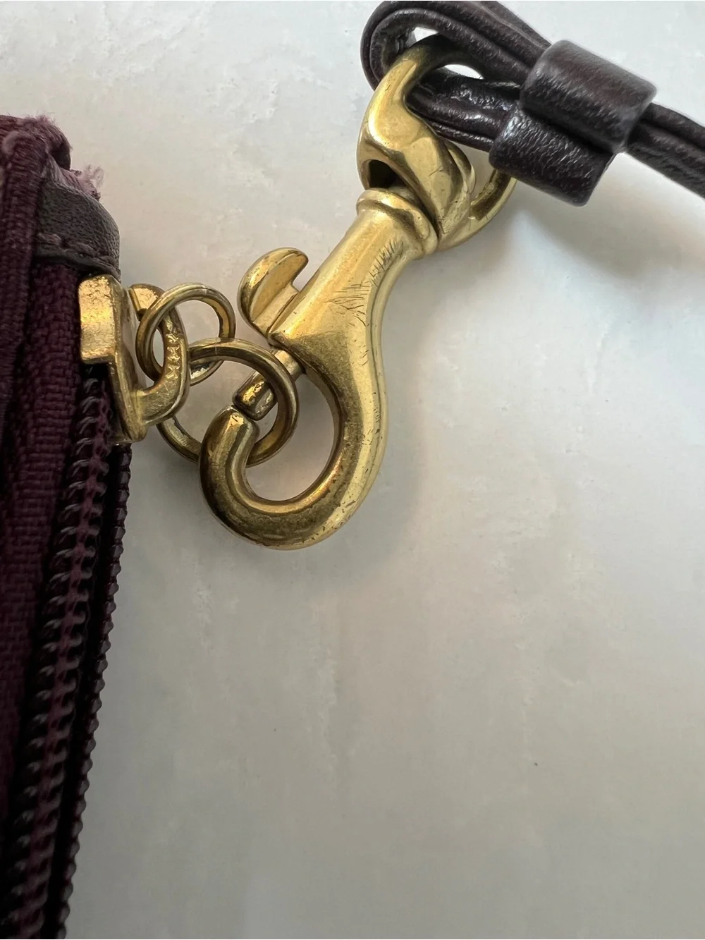 Purple jacquard Coach wristlet